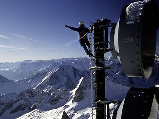 A technician at work on the radio tower on the Zugspitze.