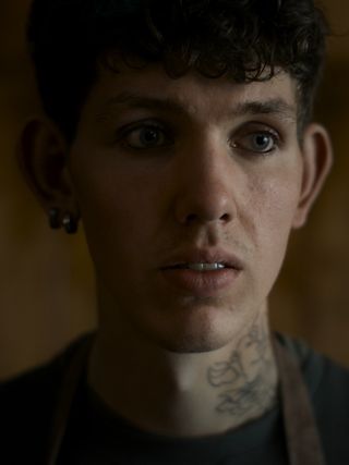 The picture shows a young man with a shocked expression on his face
