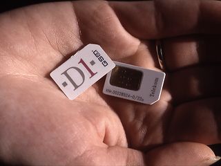 SIM card in a hand.